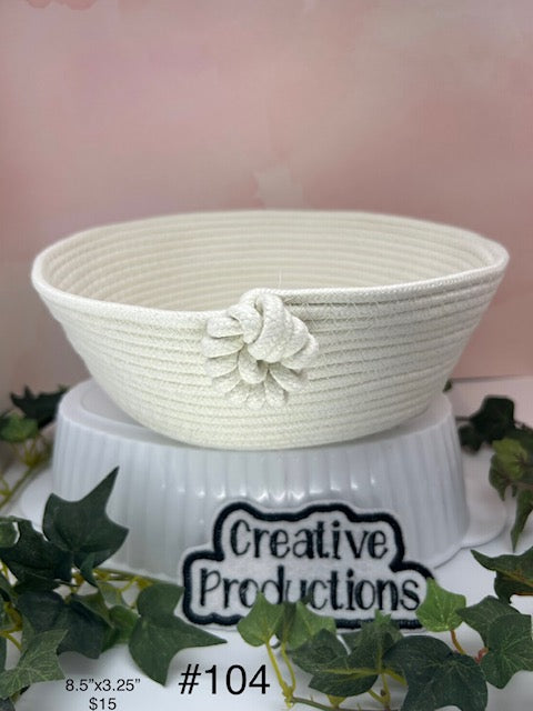 off white colored rope basket with decorative knot