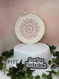 Rope trivet with embroidered design