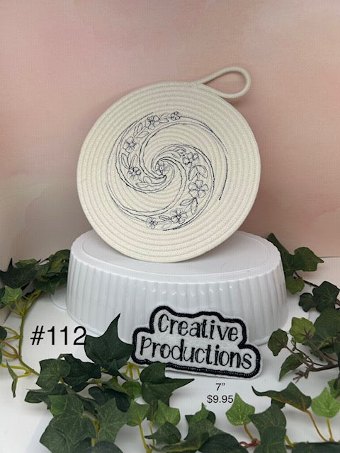 trivet with blue embroidered floral design