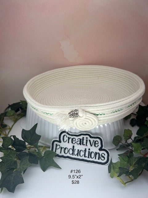 Natural colored rope basket with  green embroidered design accent