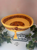 Rope basket in gold colored rope with fall print insert and trim