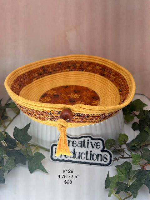 Rope basket in gold colored rope with fall print insert and trim