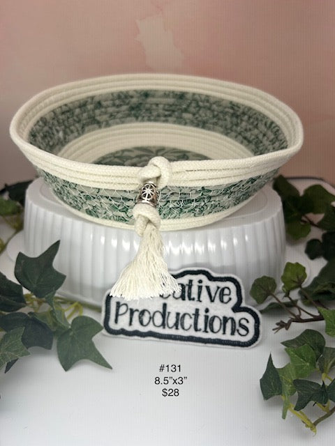 Natural colored rope basket with green tone fabric insert and trim.