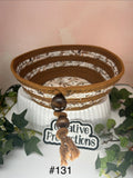 Rope basket with leaf print design fabric insert and trim