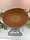 Rust brown colored rope basket with print fabric insert and trim