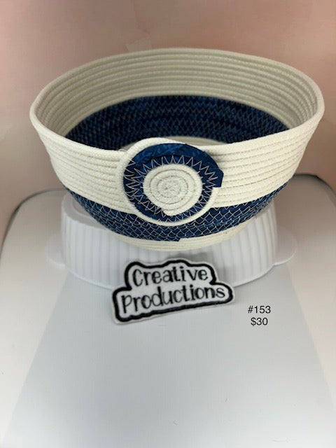 Natural colored rope basket with navy blue accents
