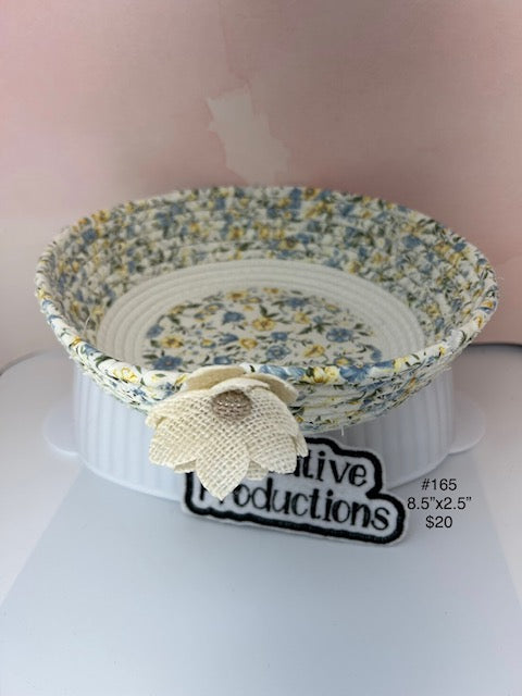 Rope basket with baby blue and yellow floral insert.