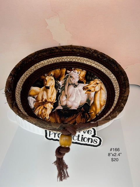 dark brown rope basket with horse design fabric insert.