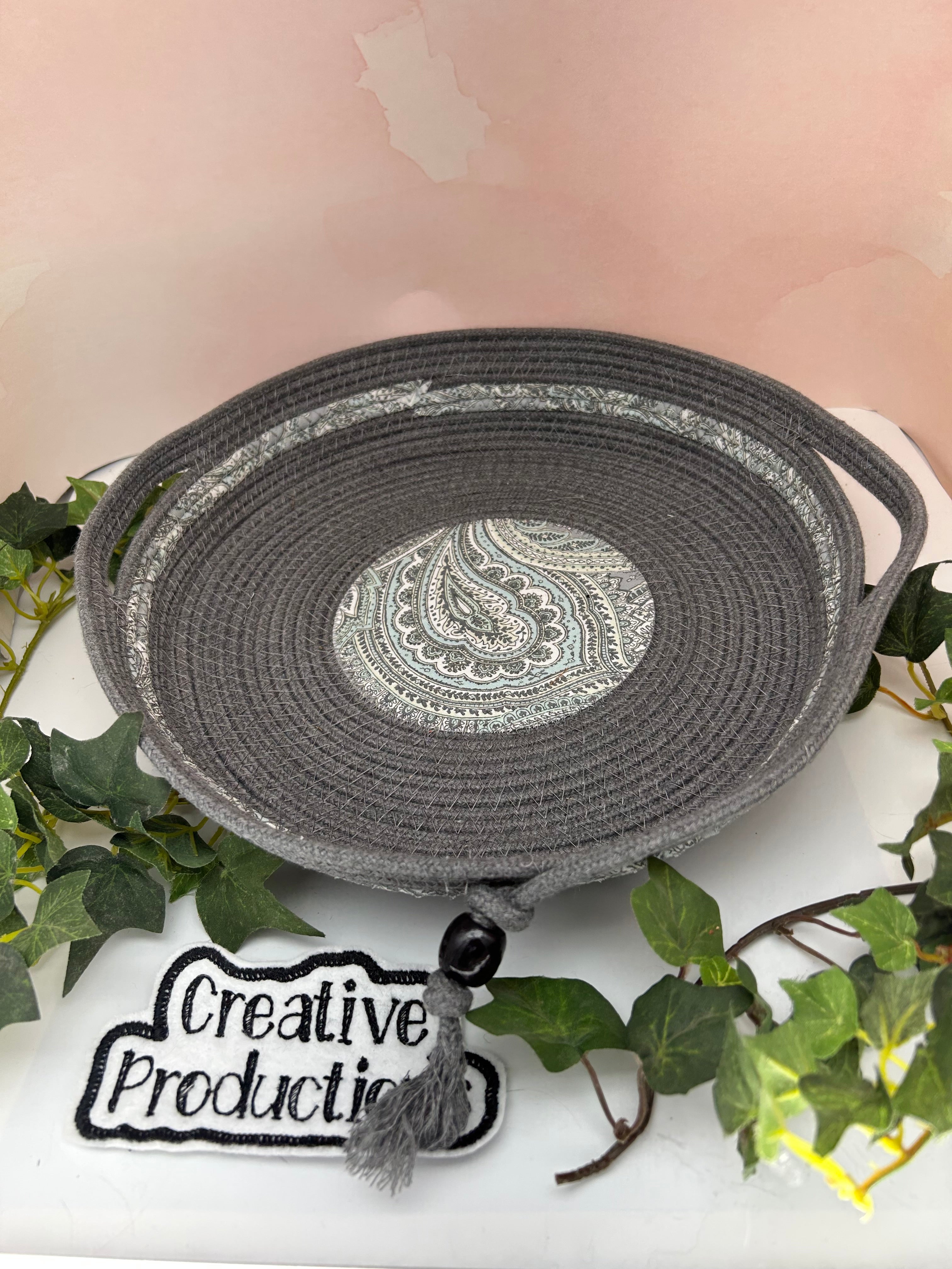 Handmade rope basket with fabric insert and decorative trim